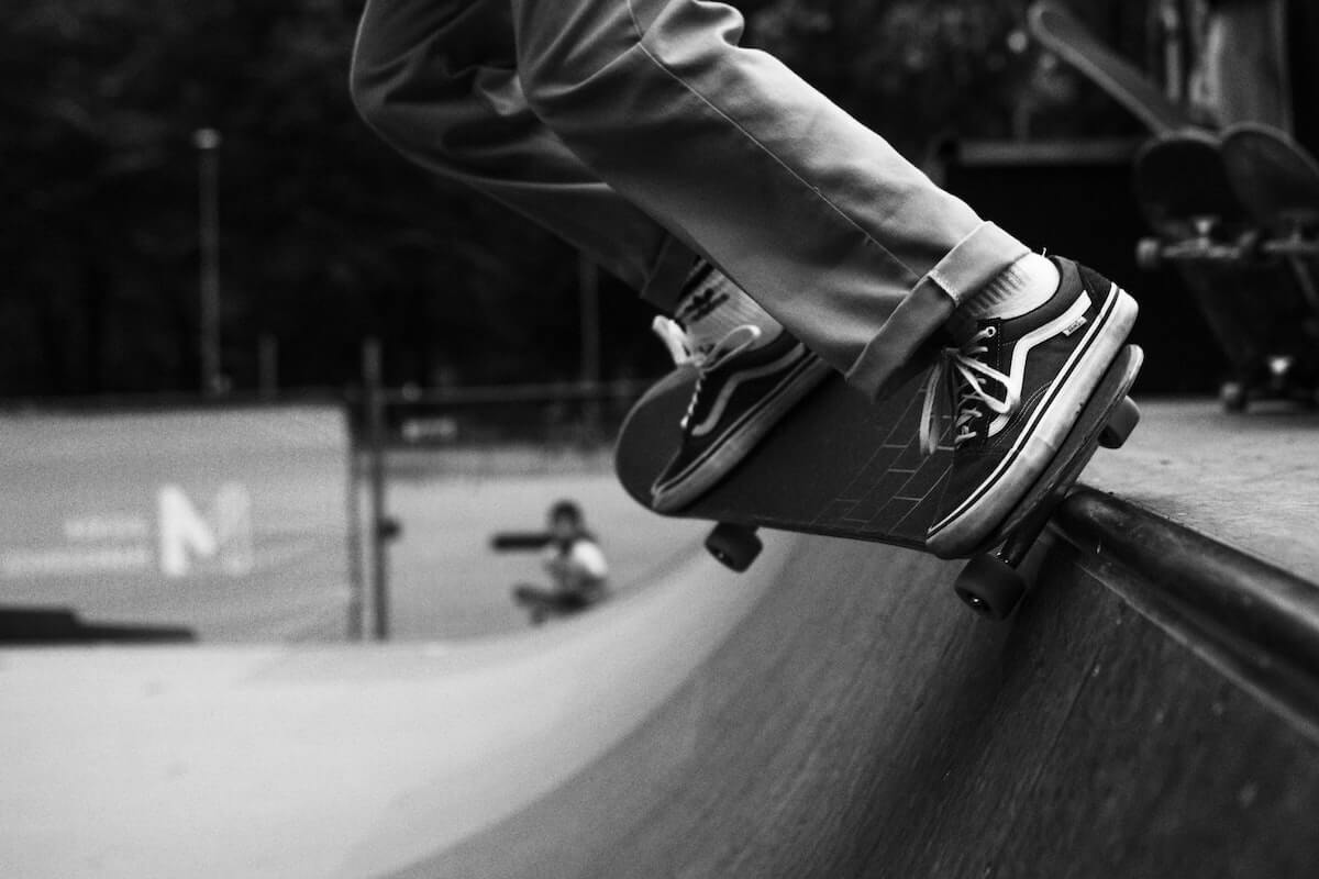 Man on a half pipe skateboarding source unsplash.